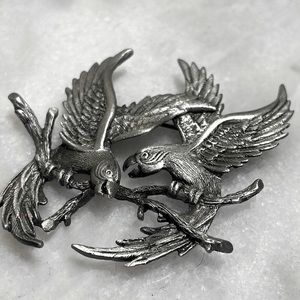 Vintage JJ Parrot Couple pin silver tone fighting birds on tree branch